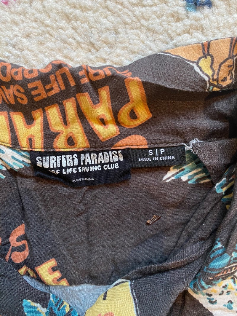 tropical print button-up shirt to be a vacation dad