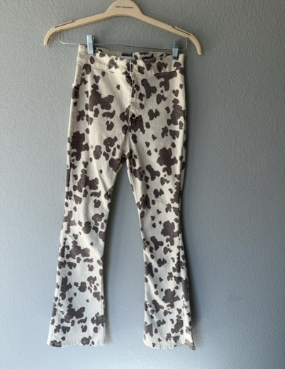 rodeo time! brown cow print flared pants