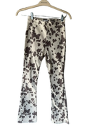 rodeo time! brown cow print flared pants