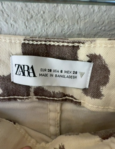 rodeo time! brown cow print flared pants