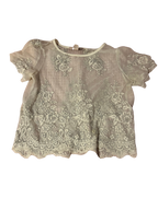white embroidered lace top with detailed hem