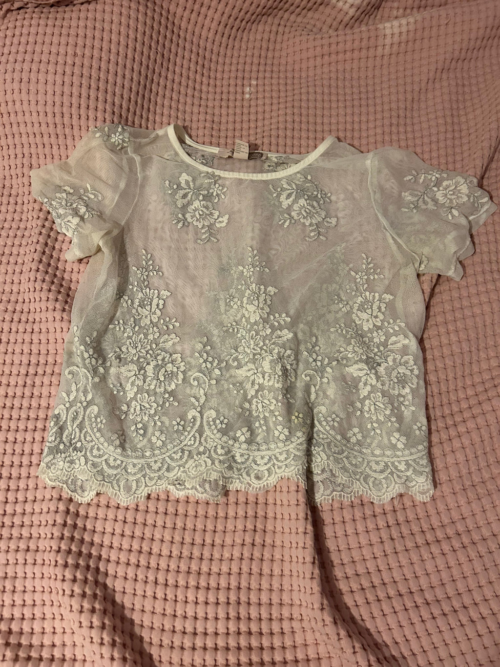 white embroidered lace top with detailed hem