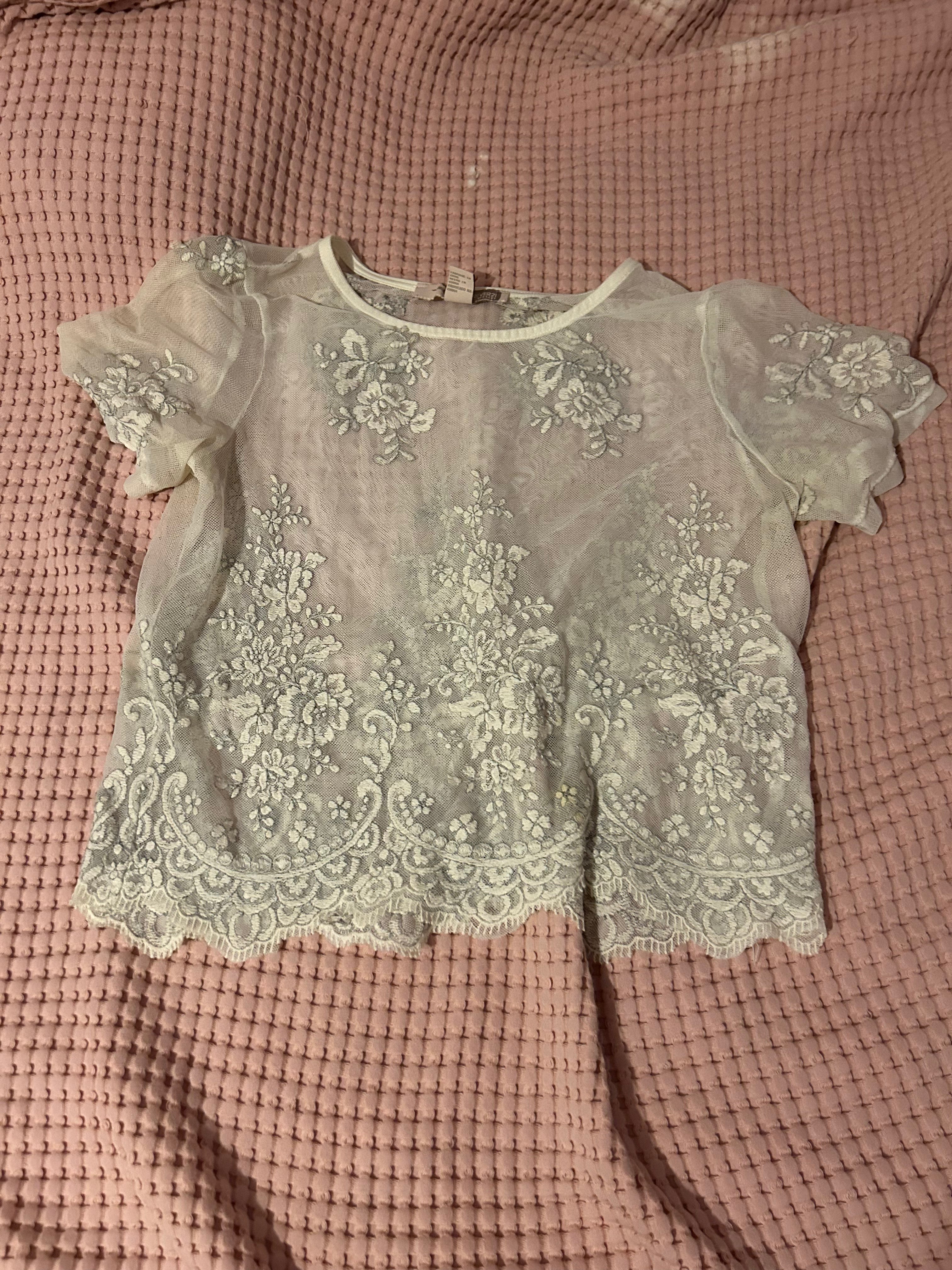 white embroidered lace top with detailed hem