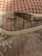 white embroidered lace top with detailed hem