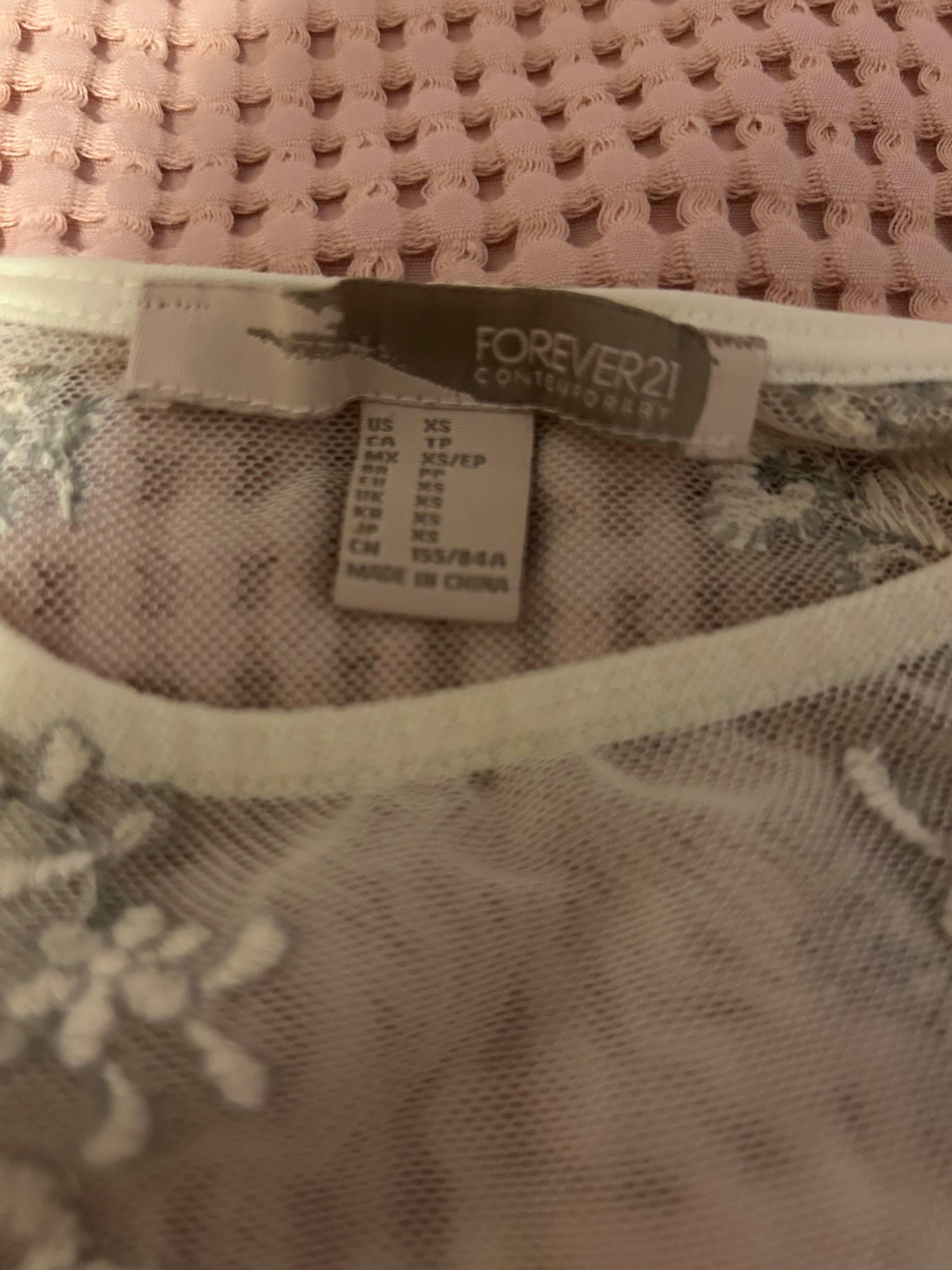 white embroidered lace top with detailed hem