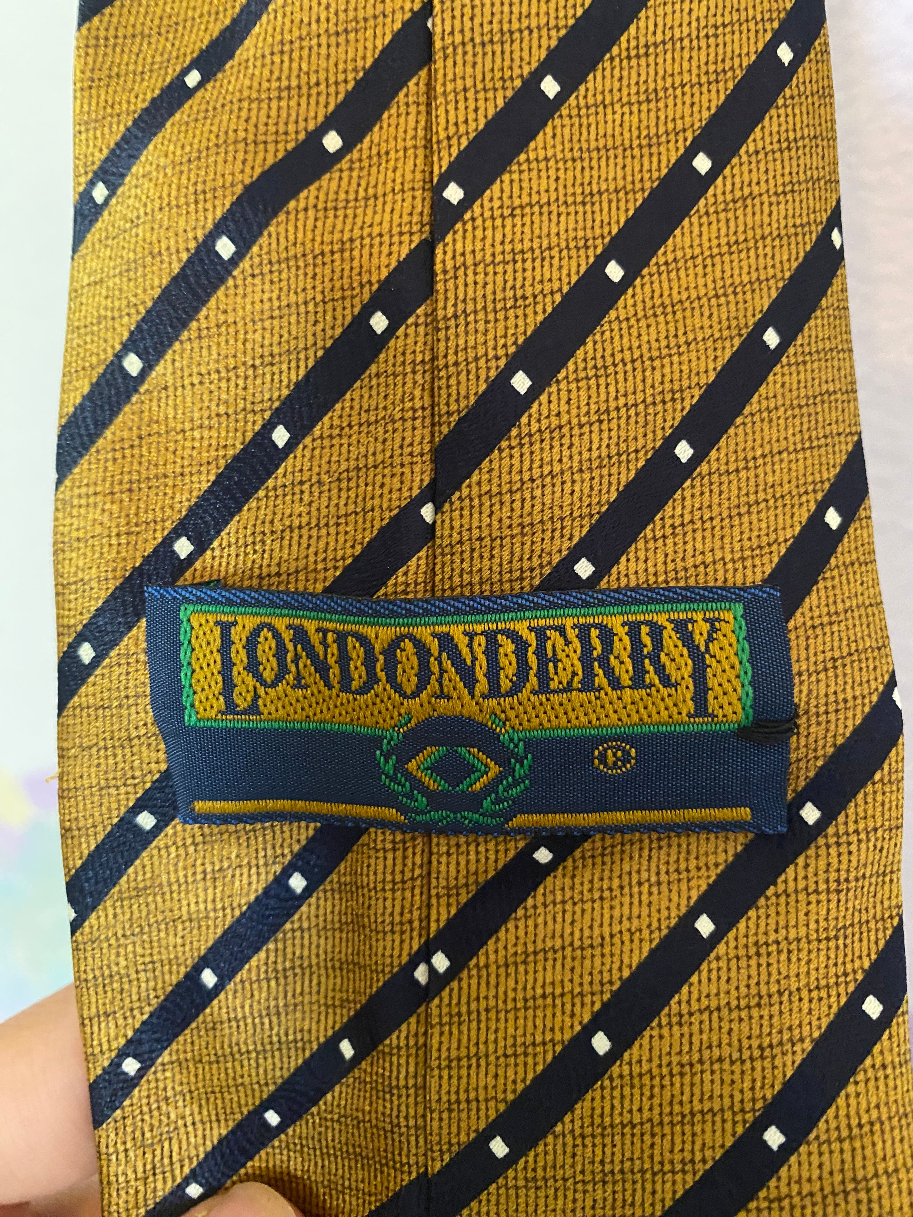 gold and navy diagonal stripe tie